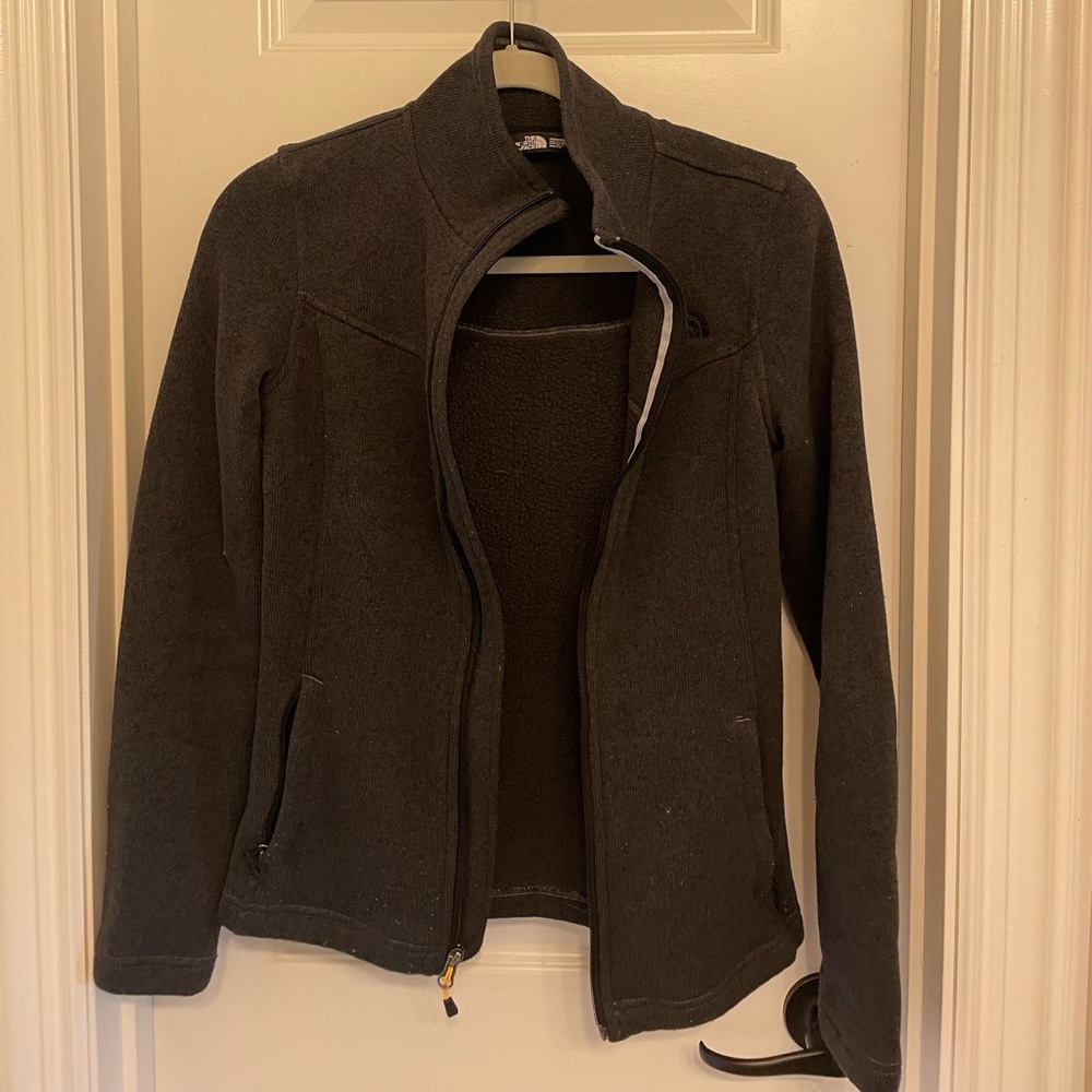 black north face zip up jacket